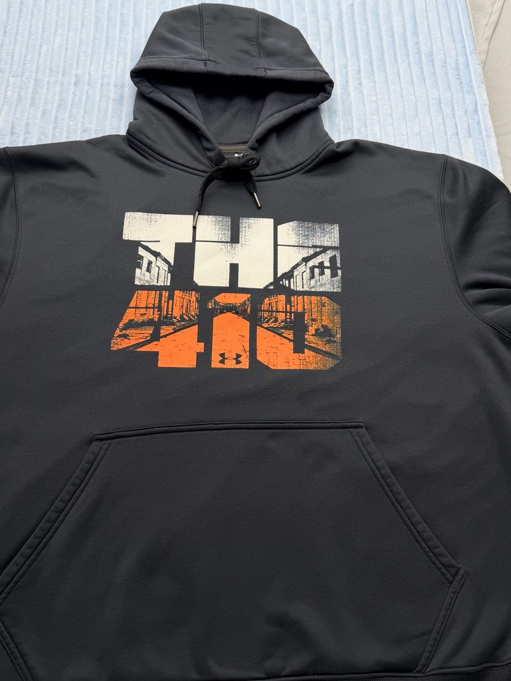 Under Armour Black Hoodie with White and Orange Chest Graphic